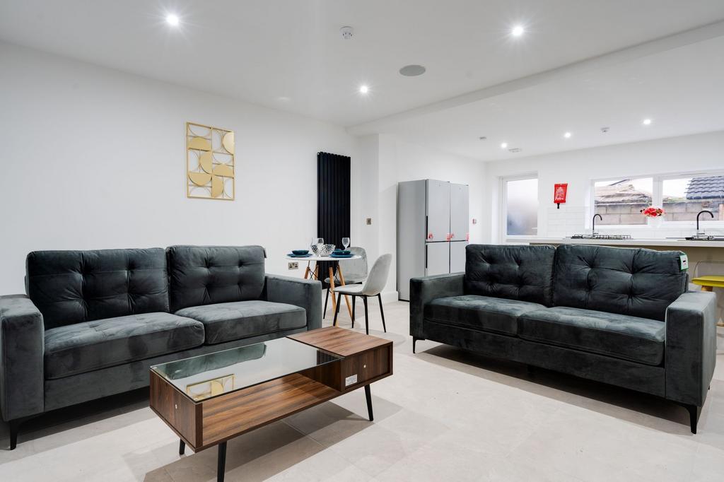 Modern and stylish living room featuring two bl...