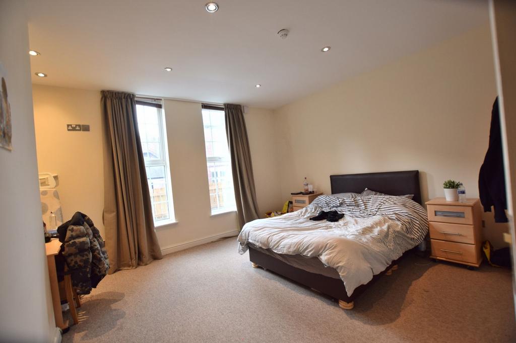 Bright, well-proportioned master bedroom with t...