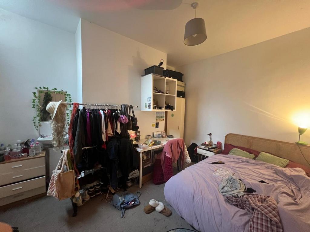 Bright, well-lit double bedroom with a comfy do...