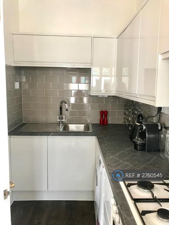 Galley Kitchen With Balcony