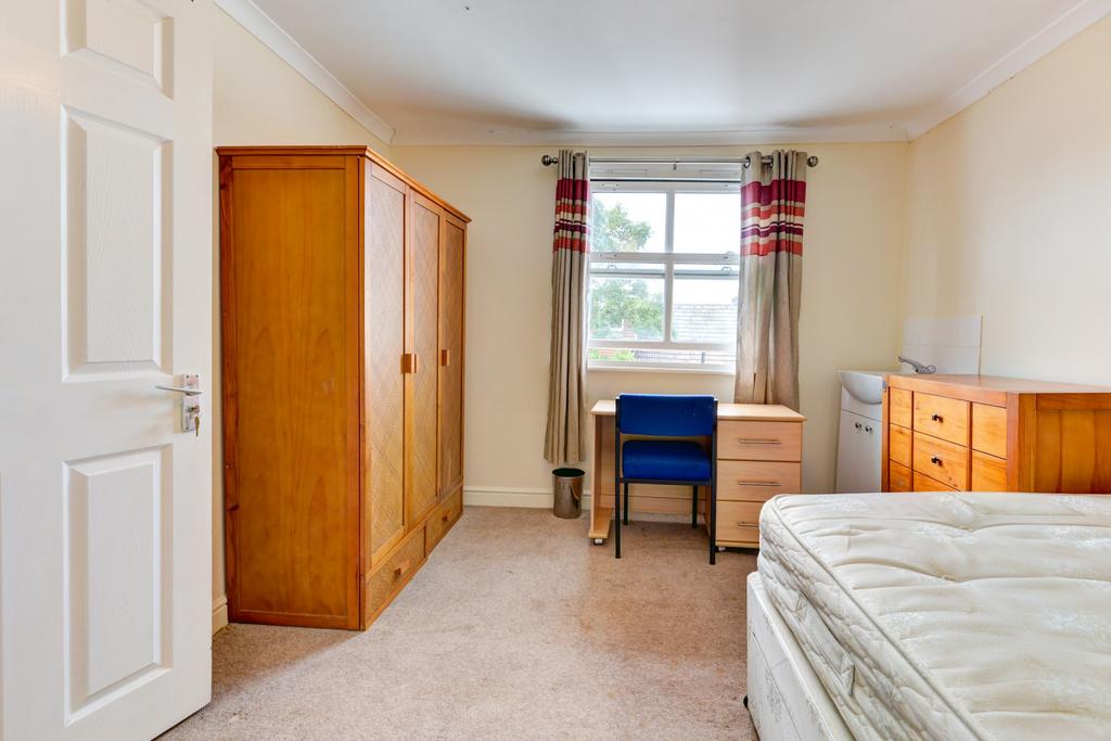 Bright, neatly presented bedroom with a double ...