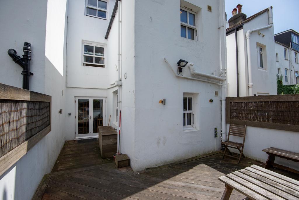 Private courtyard with wooden decking, outdoor ...
