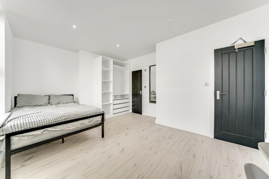Bright, modern living room featuring minimalist...