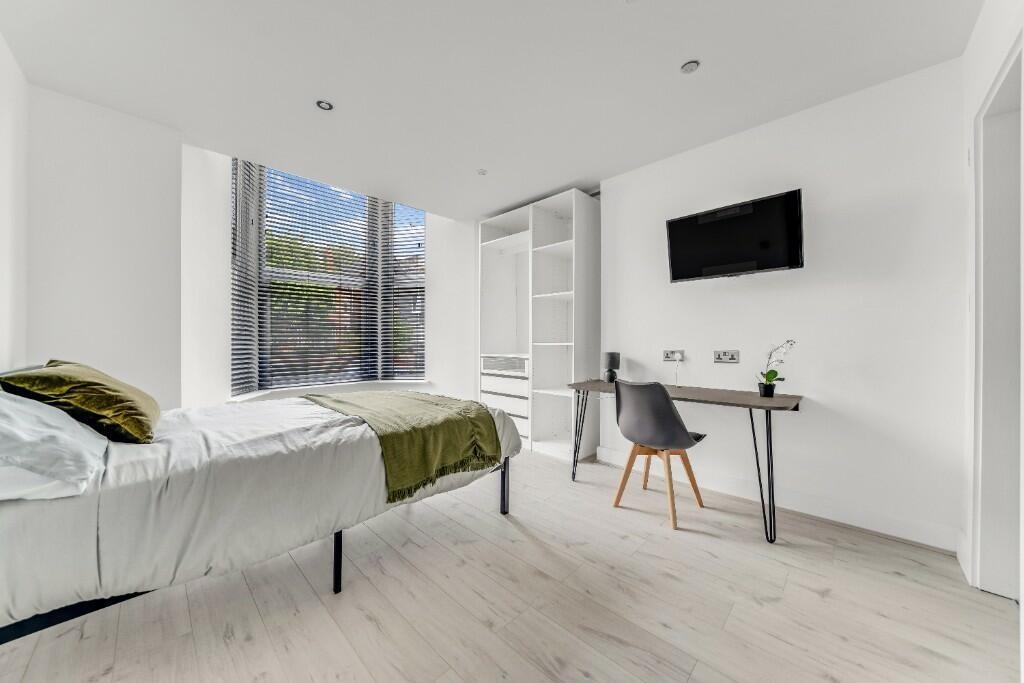 A modern, bright living room featuring a minima...