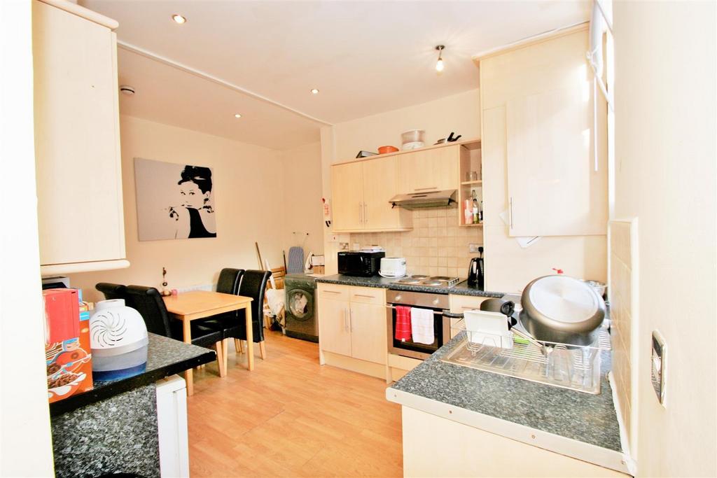 Bright, functional kitchen with ample storage s...