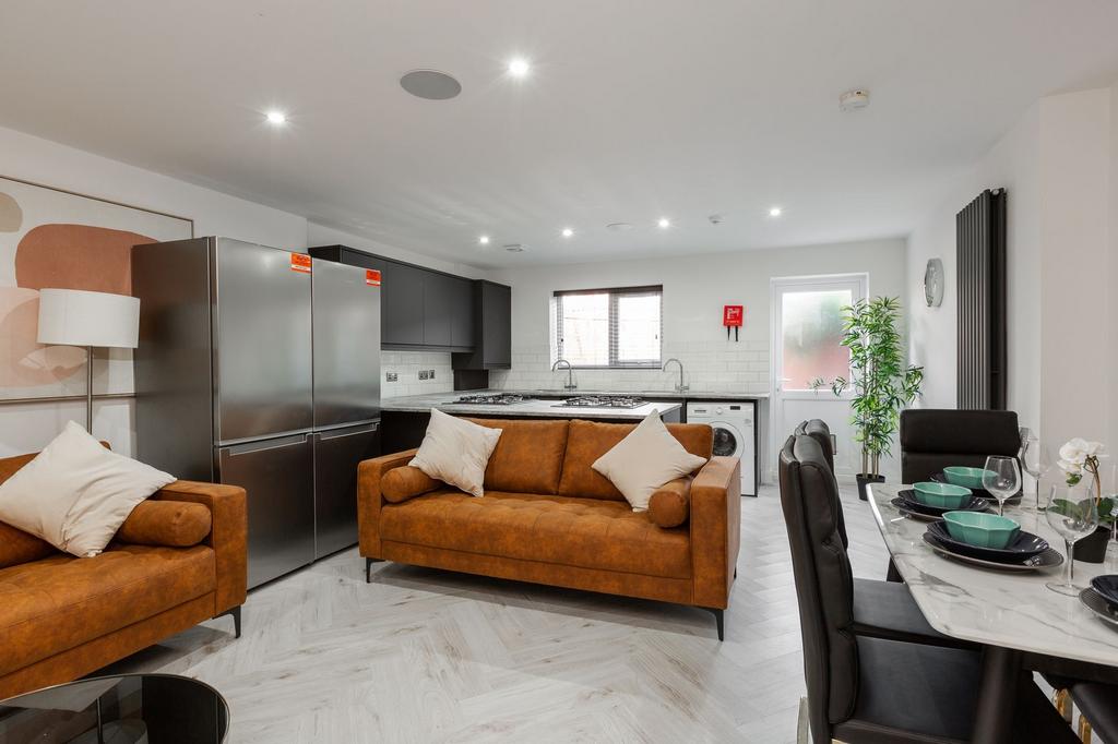 Bright and spacious living area featuring moder...