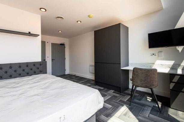 Bright and spacious master bedroom featuring a ...