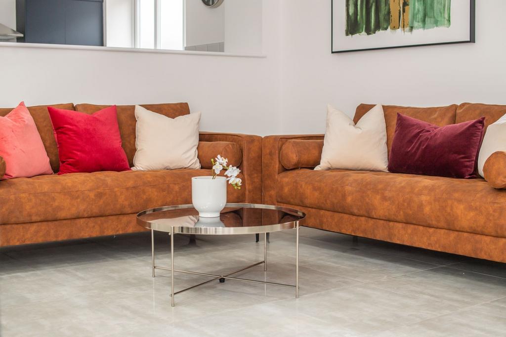 A contemporary living room featuring two large ...