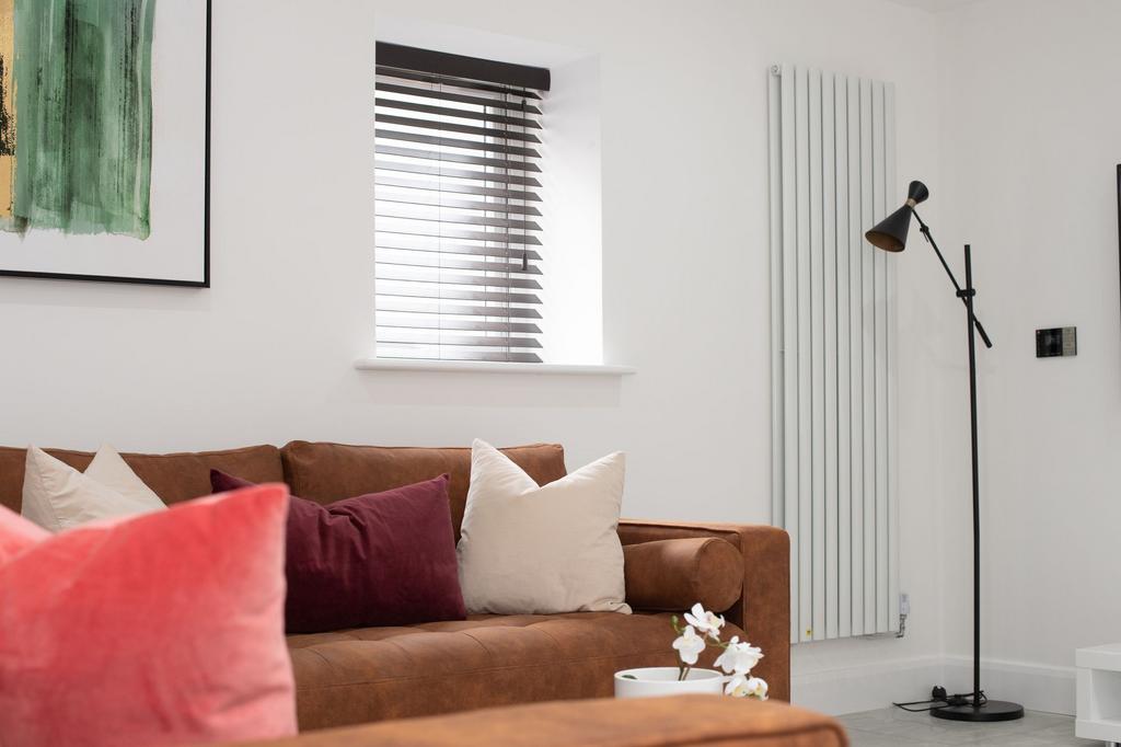 Bright and inviting living room featuring a com...