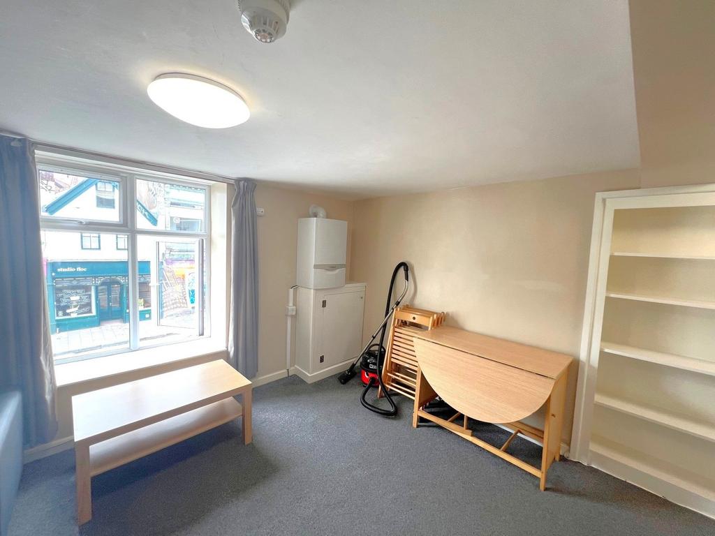 Bright street-facing sitting room with a large ...