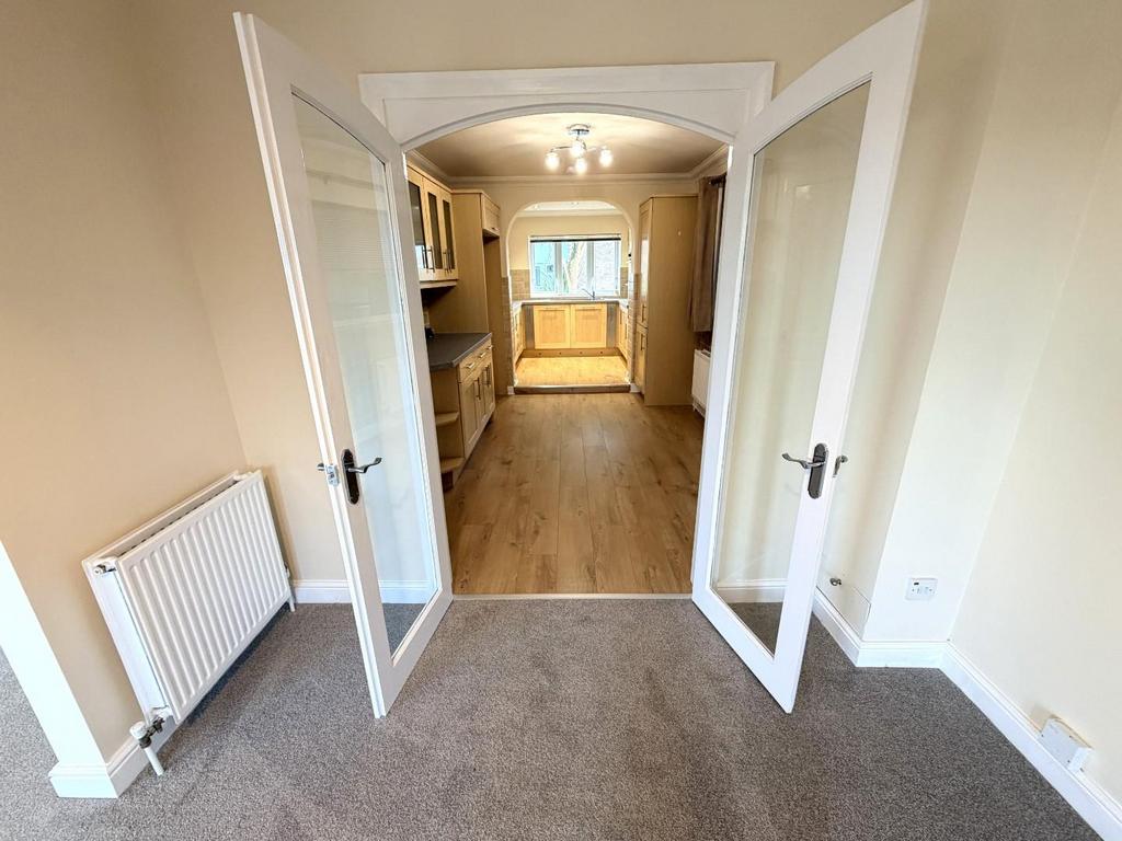 Double doors into the kitchen