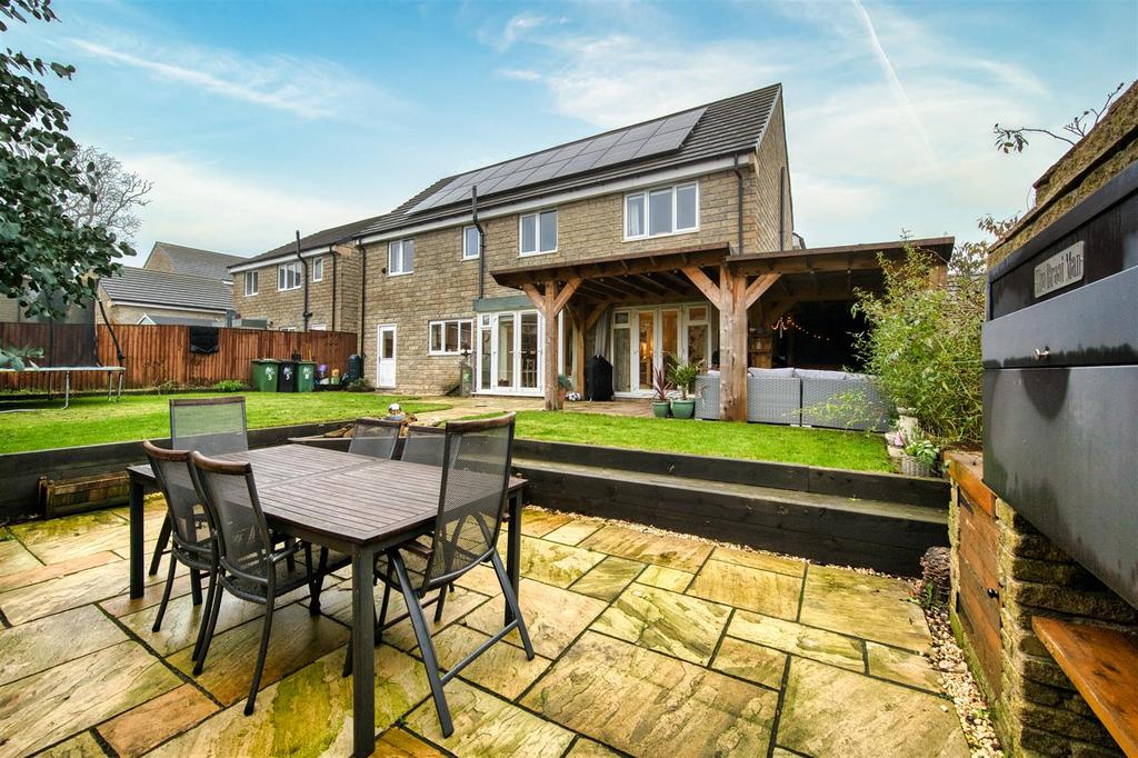 Rear Garden - dining patio and rear of the home.jp