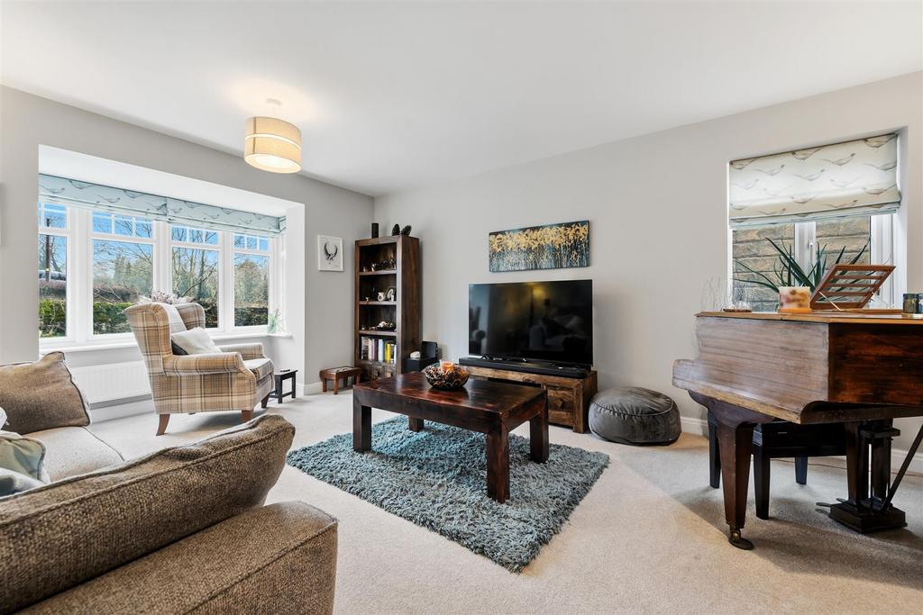 Lounge to piano and windows.jpg