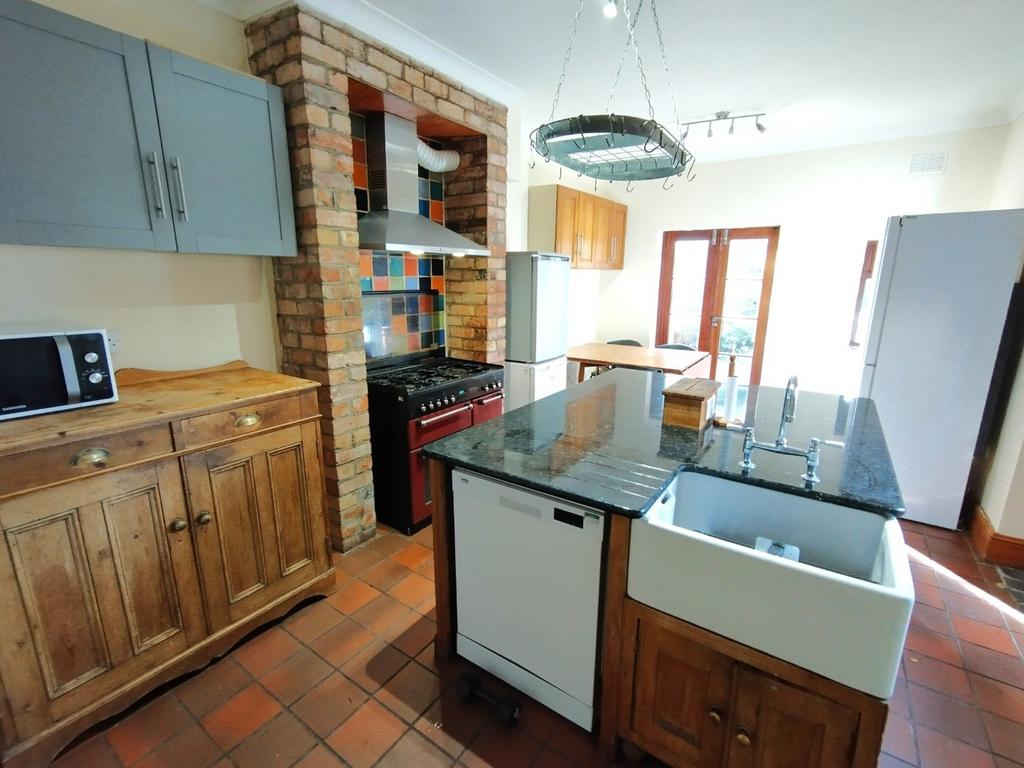 Bright, characterful kitchen with a central isl...