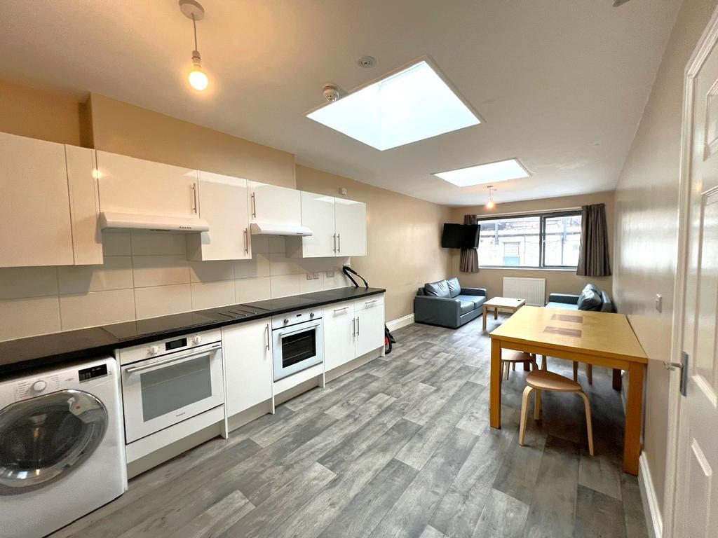 Bright open-plan living area with a modern fitt...