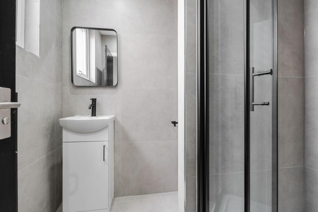 Modern and clean bathroom with a compact white ...