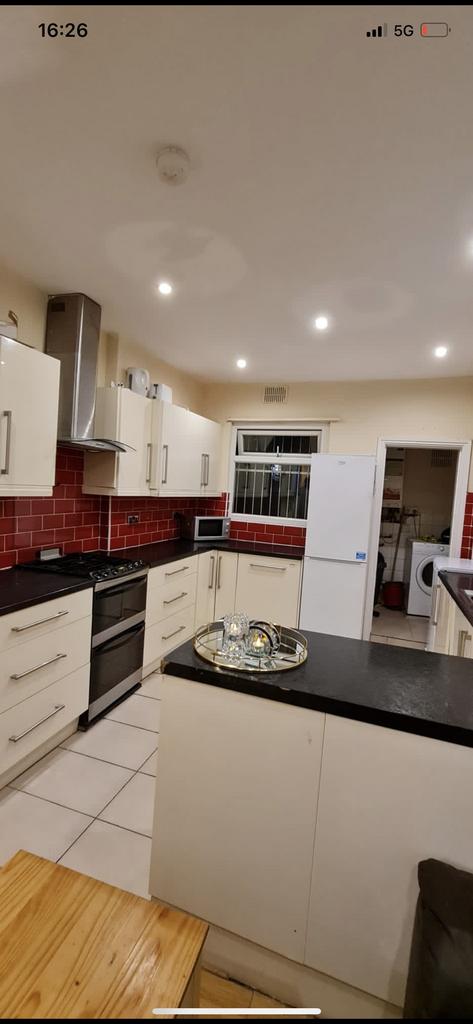 Bright modern kitchen with white cabinets, cont...