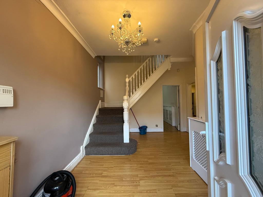 Bright, welcoming entrance hallway with a decor...