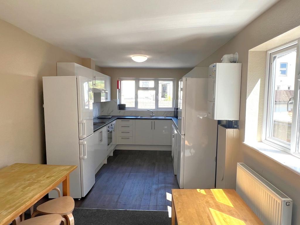 A bright, modern kitchen with ample natural lig...