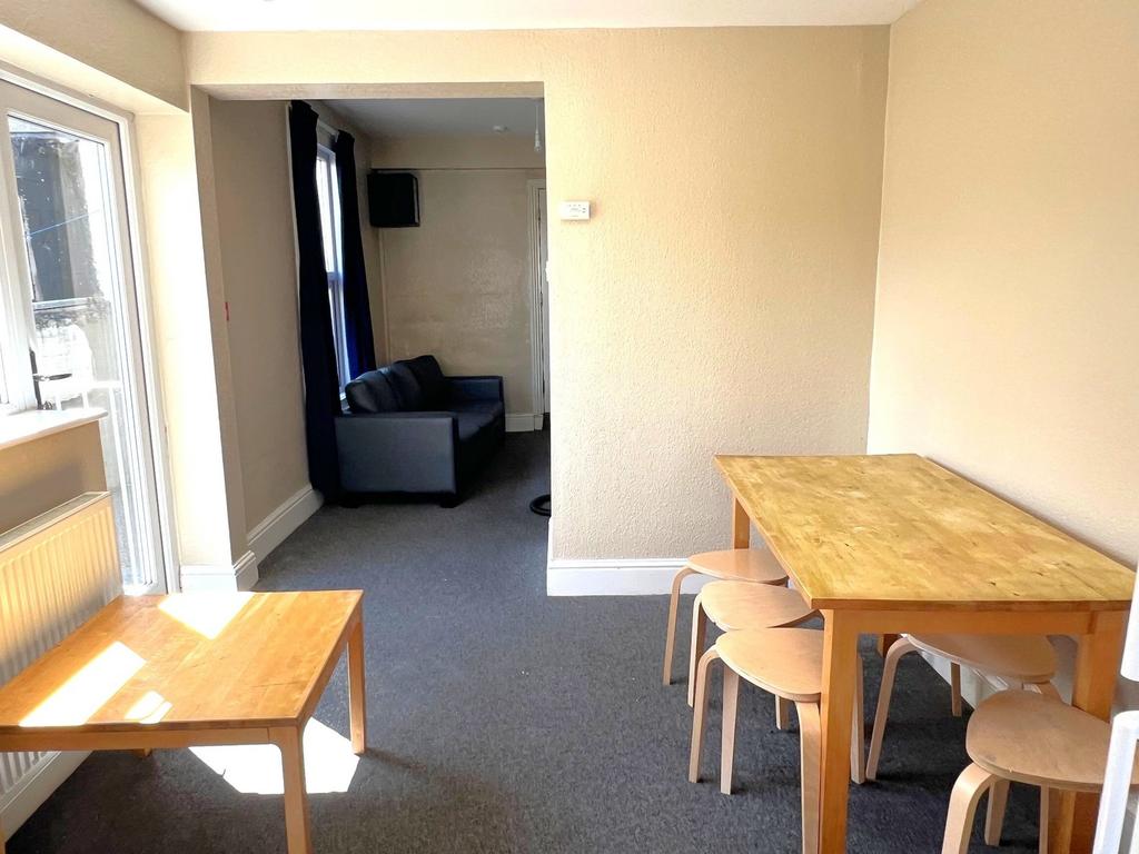 Bright and welcoming living room with natural l...