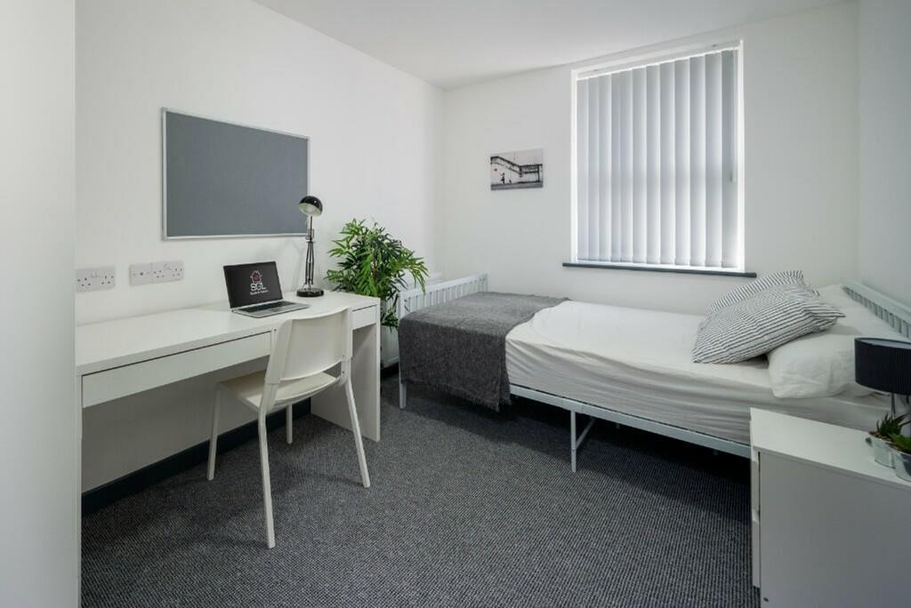 A bright and spacious double bedroom featuring ...