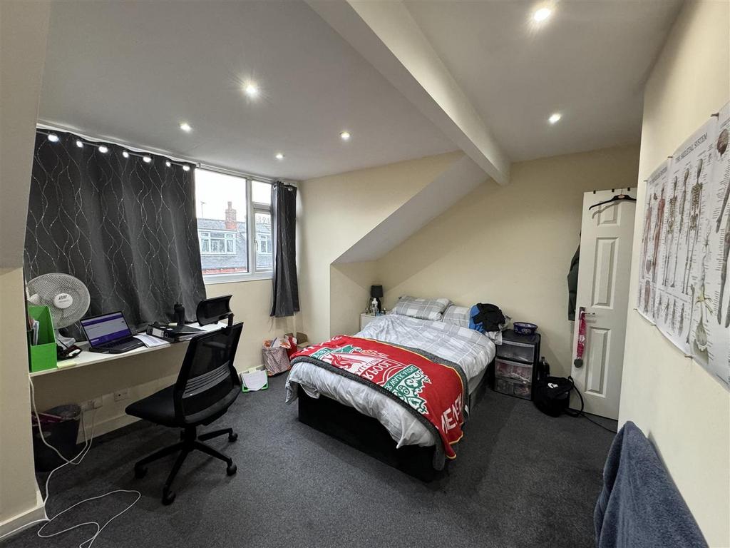 Bright and welcoming living room with ample nat...