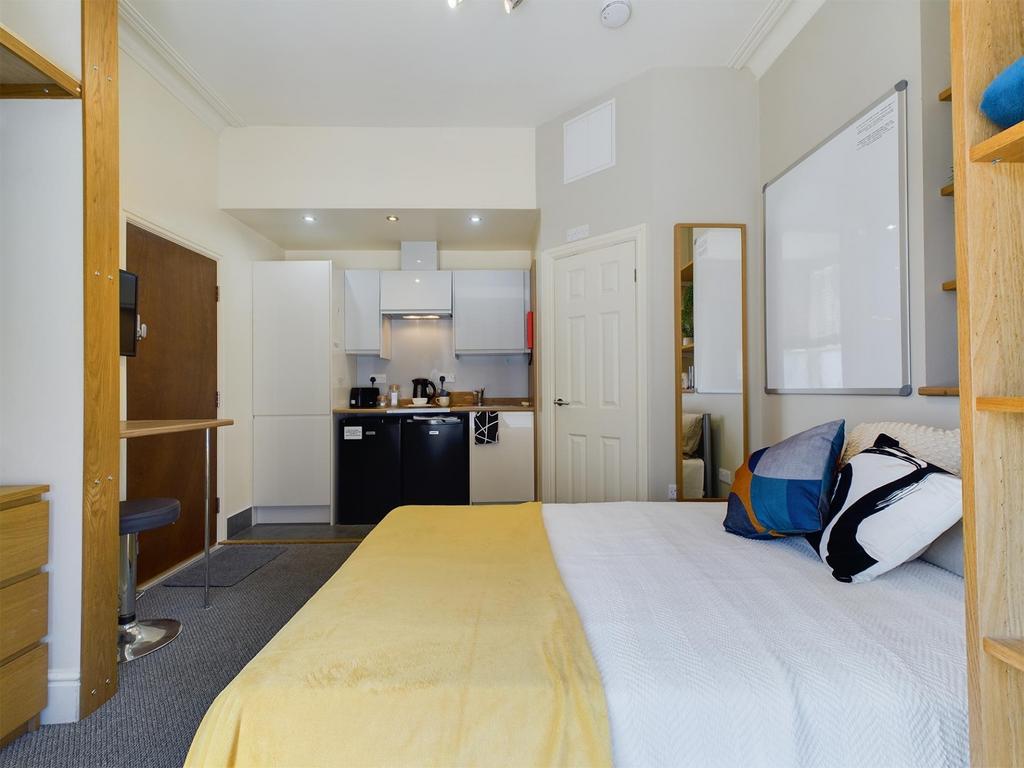 Bright, neatly presented bedroom with a comfort...