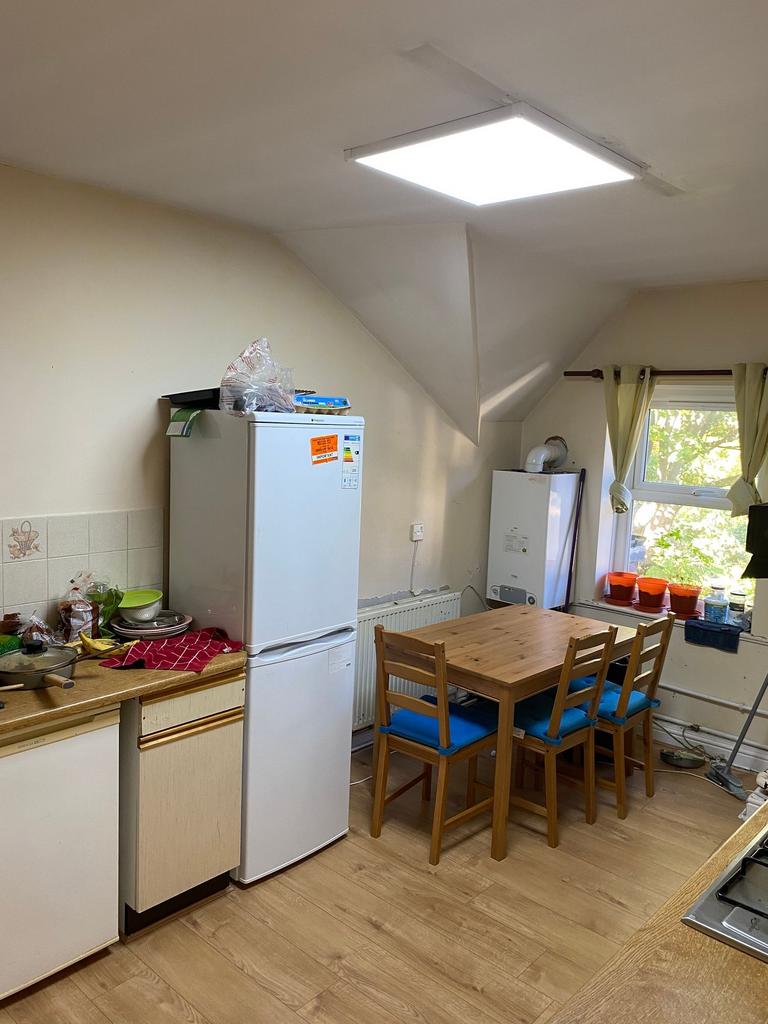 A practical and well-used kitchen area featurin...