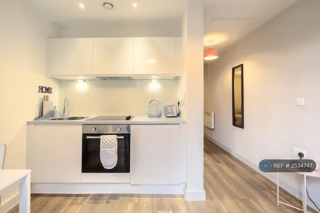 Kitchen With 4-Ring Electric Stove &amp; Oven