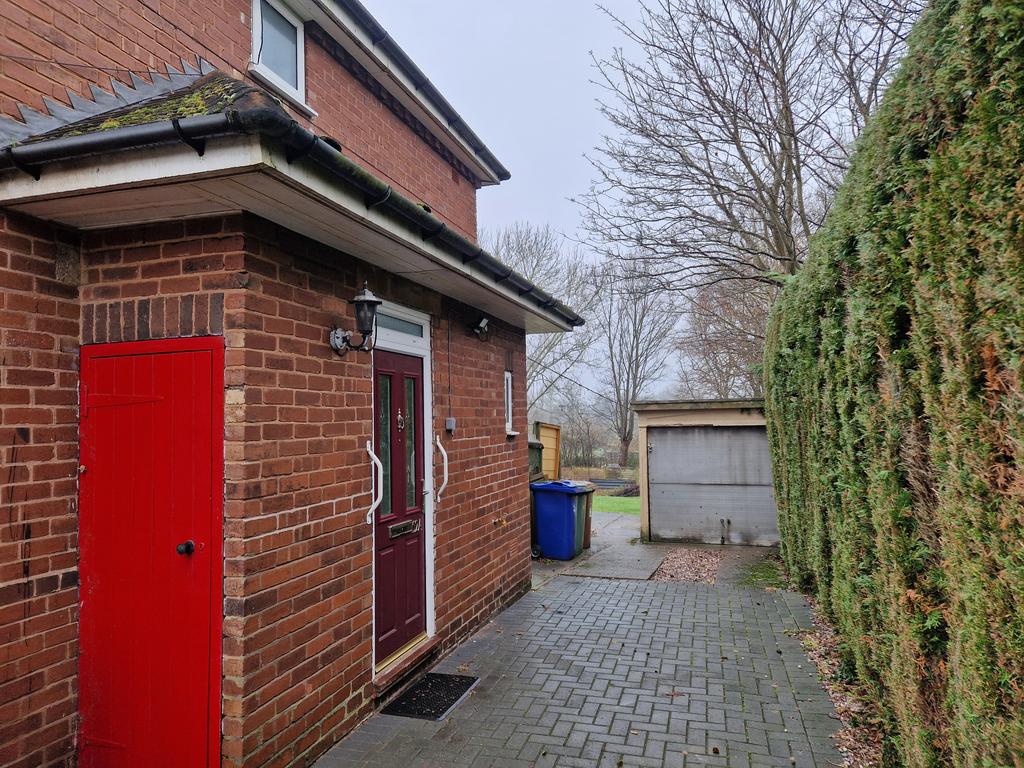 Entrance to property and garage front