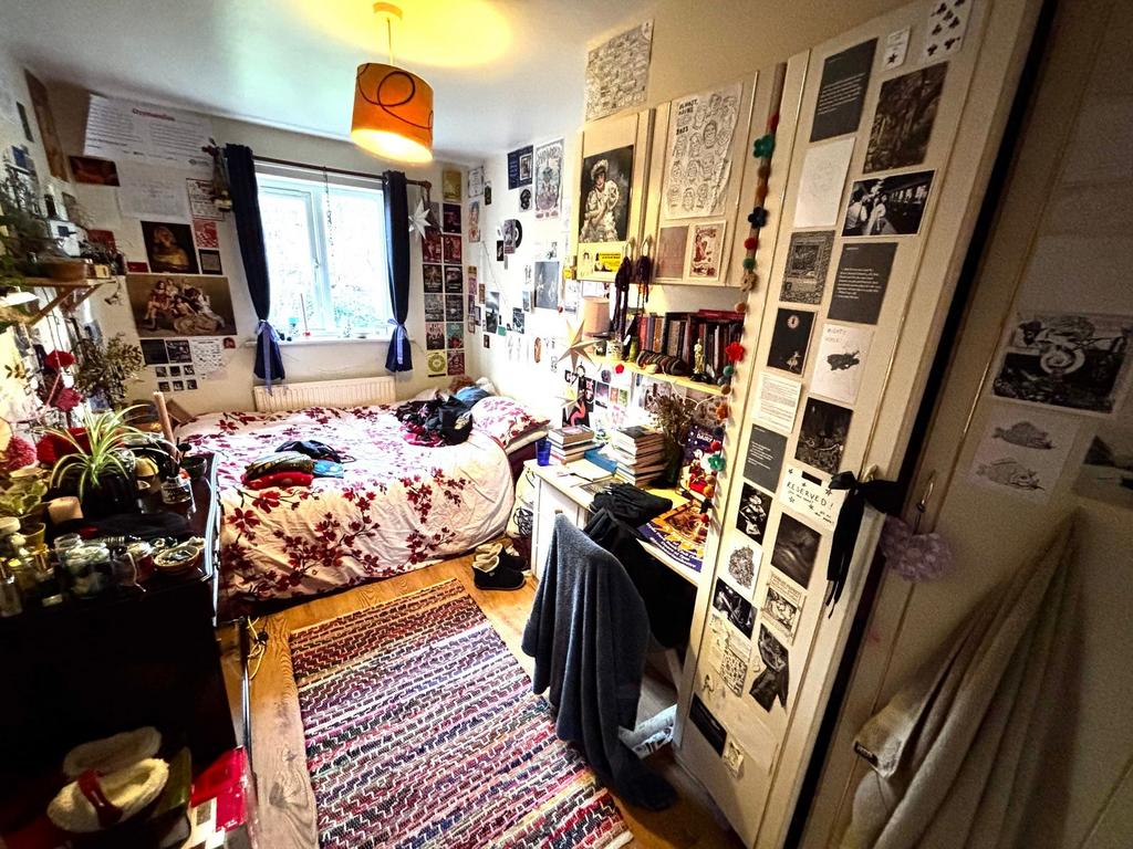 Cosy, characterful bedroom with a double bed dr...