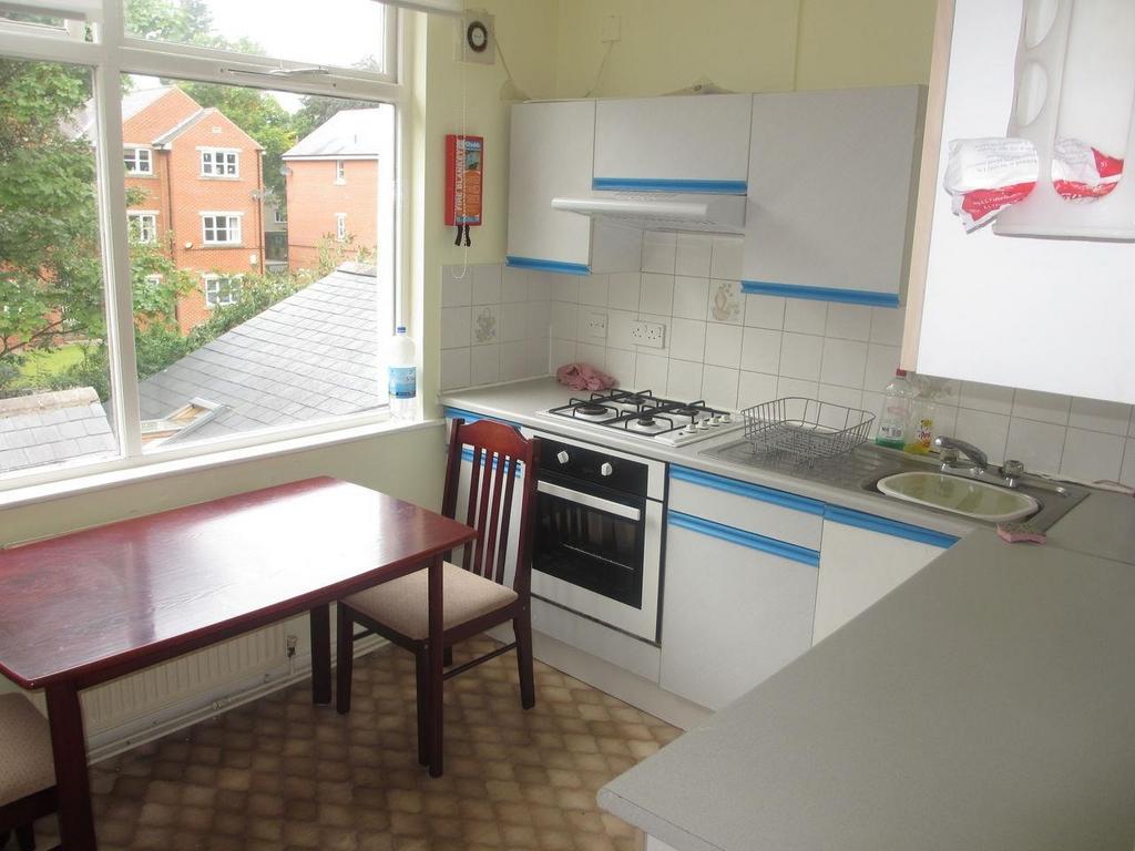 Bright and functional kitchen with ample natura...