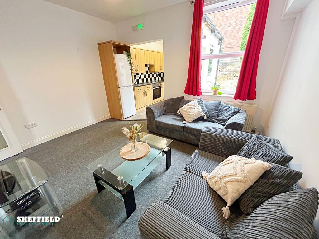 Bright furnished living room with two comfortab...
