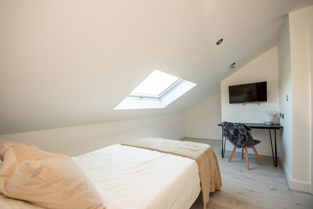 Bright and airy bedroom featuring a comfortable...