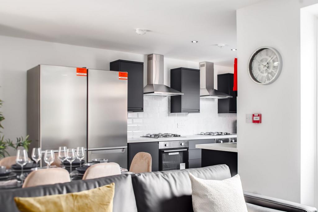 Modern and sleek kitchen with stainless steel a...