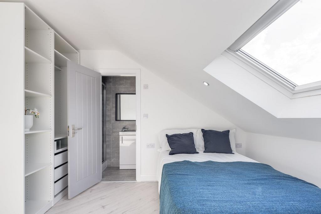 Bright and modern double bedroom featuring two ...