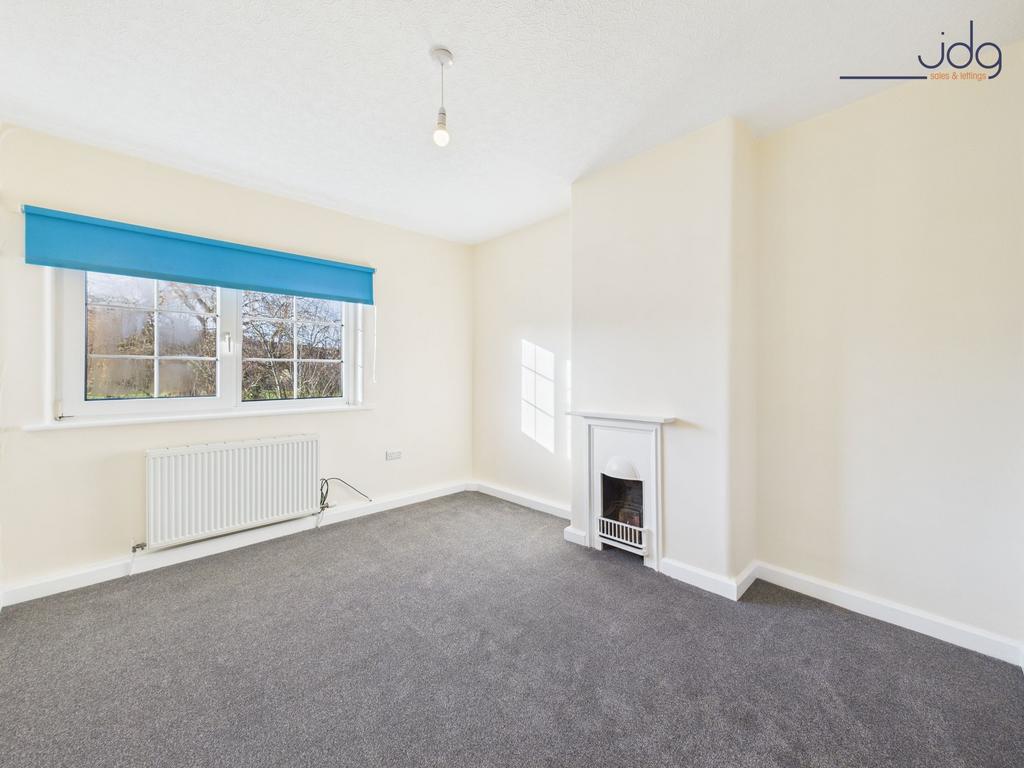 Bedroom with period fireplace (decorative use...