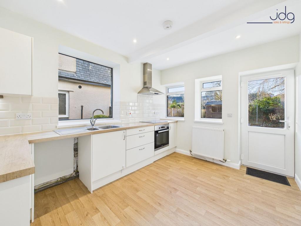 Kitchen with access to rear garden.