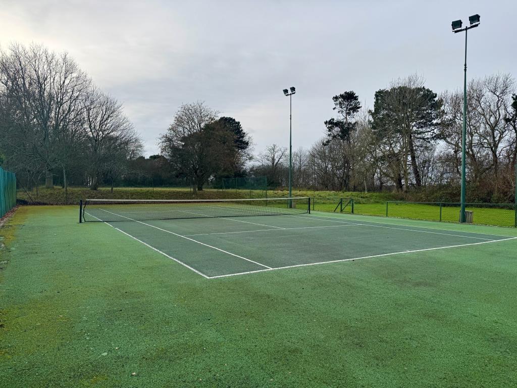 Outside tennis court-inside the court