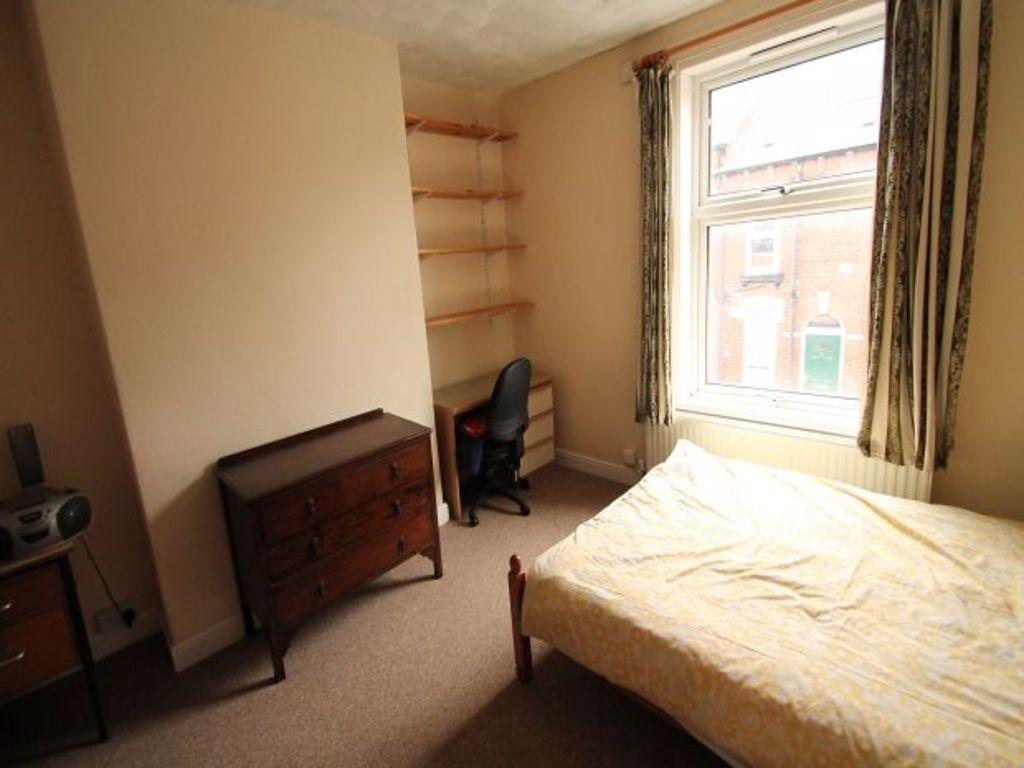 Bright single bedroom with a large window, fitt...