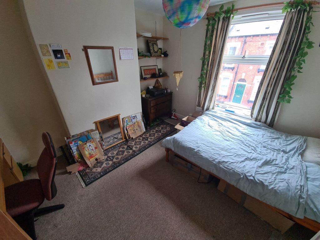 Bright double bedroom with a large window, tidy...