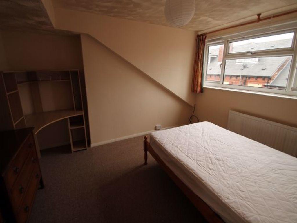 Cozy upstairs bedroom with a single bed, neutra...