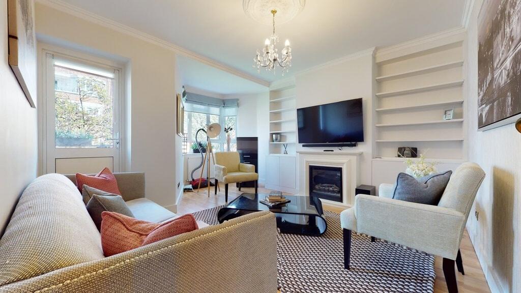 Bright, well-styled living room with comfortabl...