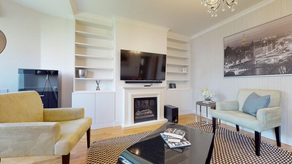 Well-presented living room with a wall-mounted ...