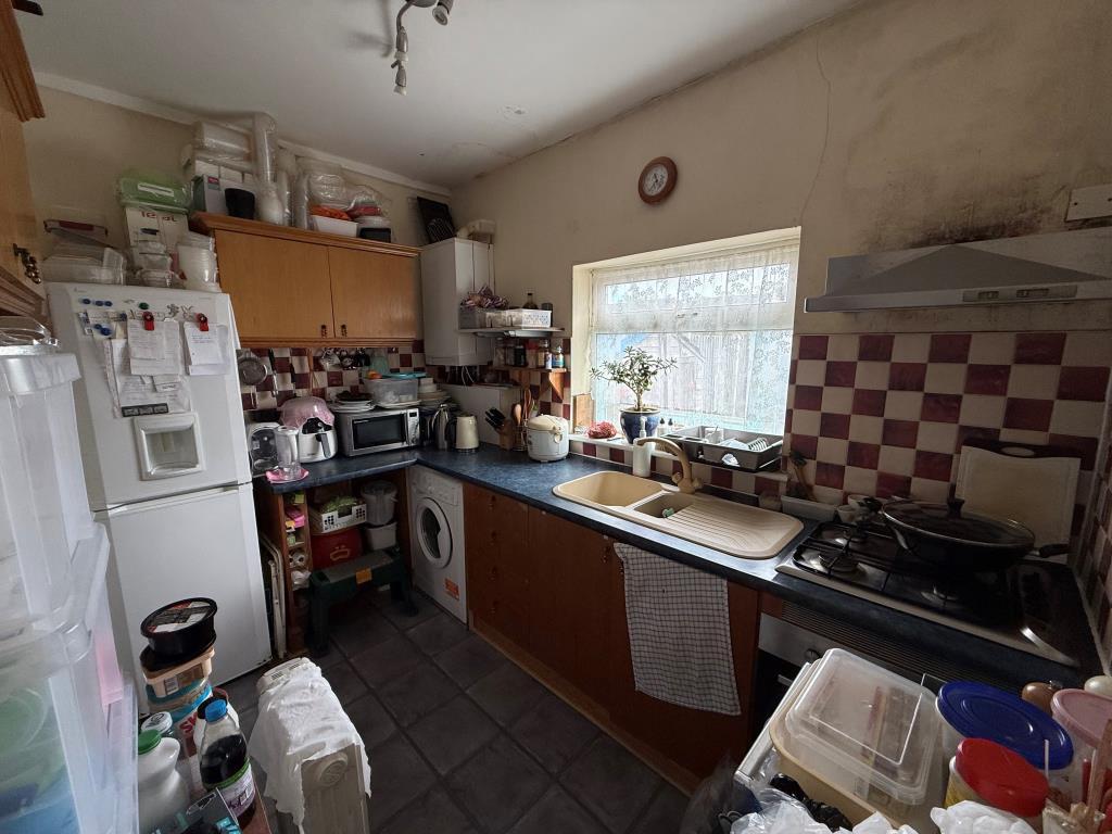 Kitchen with window and built in units