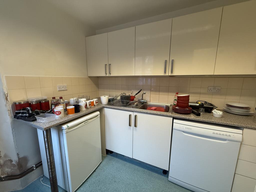 Kitchen with fitted units and boiler room to rear