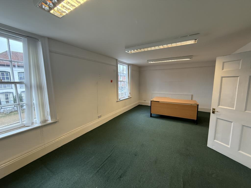 First floor office room with carpets and painted w