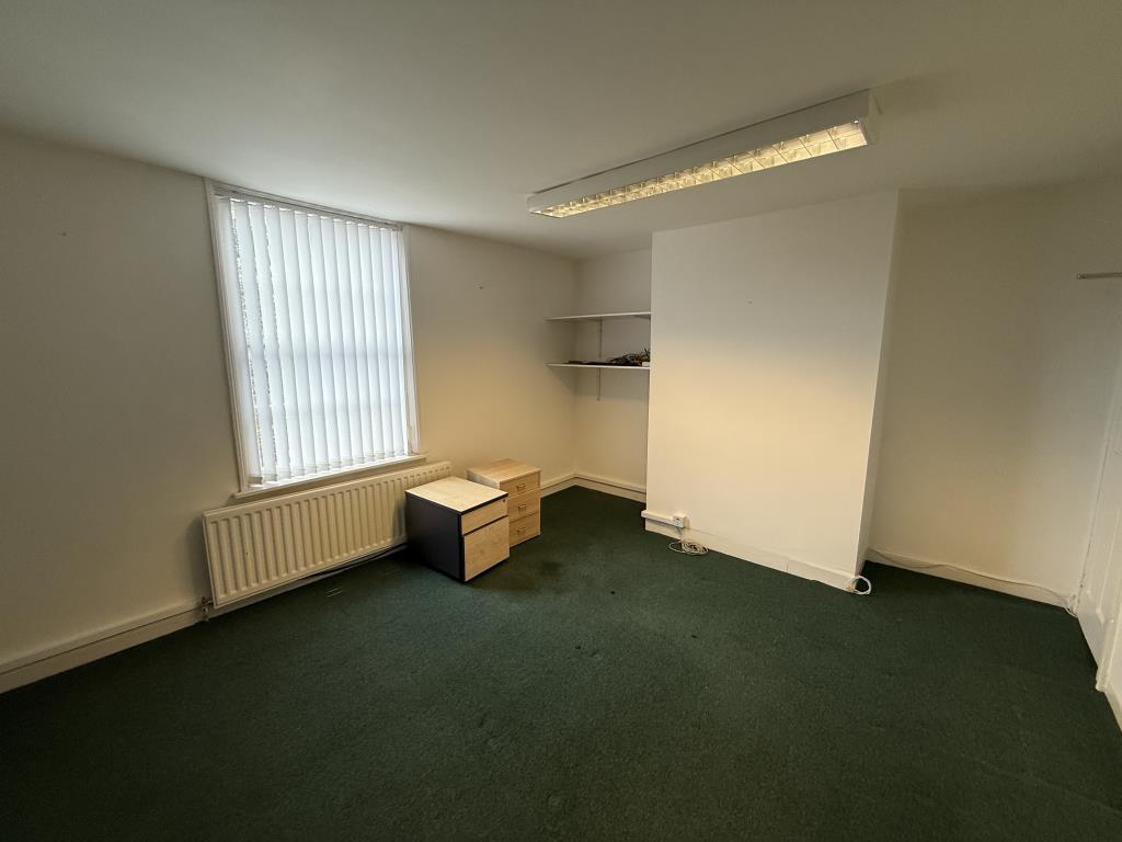 Second floor office room with carpets and painted