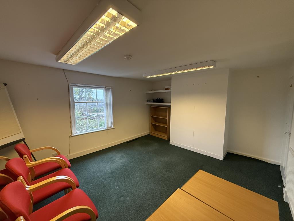 Second floor office room with carpets and painted