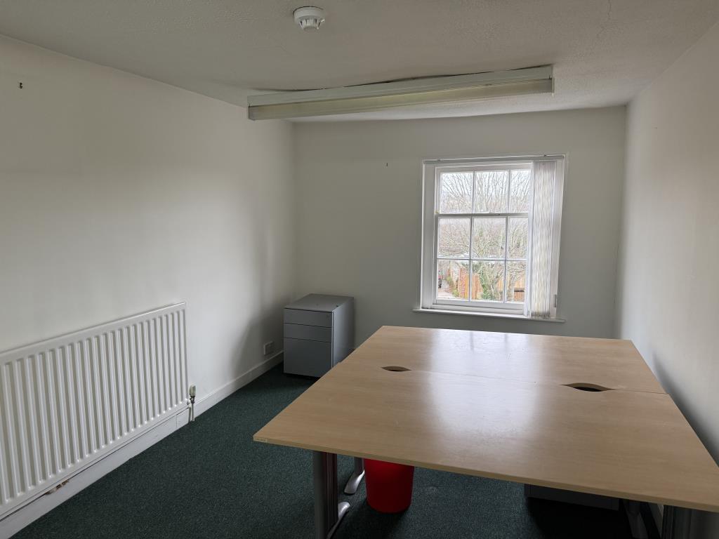 Second floor office room with carpets and painted